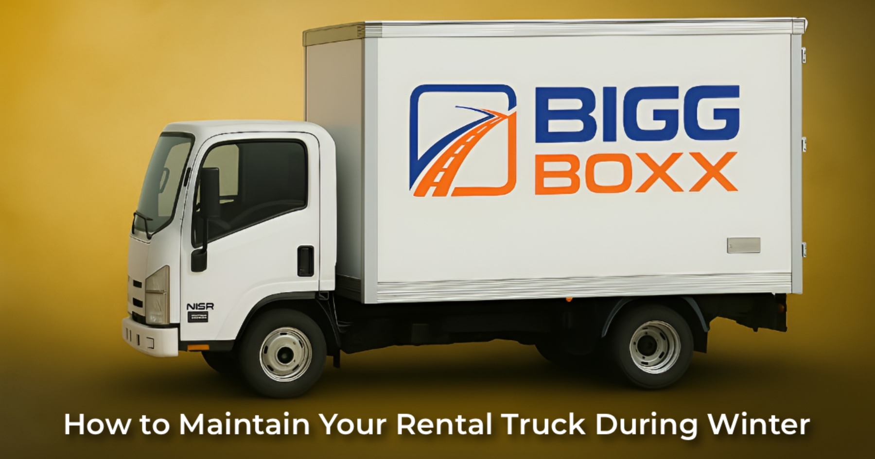 Side view of a white Bigg Boxx rental box truck positioned against a solid yellow-gold background | How to Maintain Your Rental Truck During Winter | Bigg Boxx Rentals