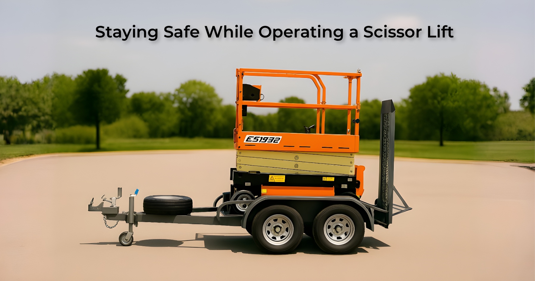 Side view of an orange and yellow scissor lift secured on a flatbed trailer in an open outdoor area with trees in the background | Staying Safe While Operating a Scissor Lift | Bigg Boxx Rentals
